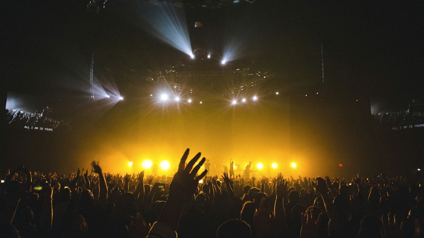 Warm wide shot of a stage mid-performance