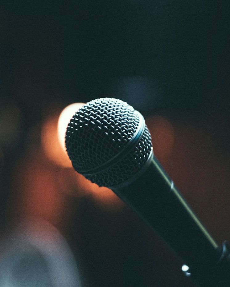 Stage microphone in low warm light